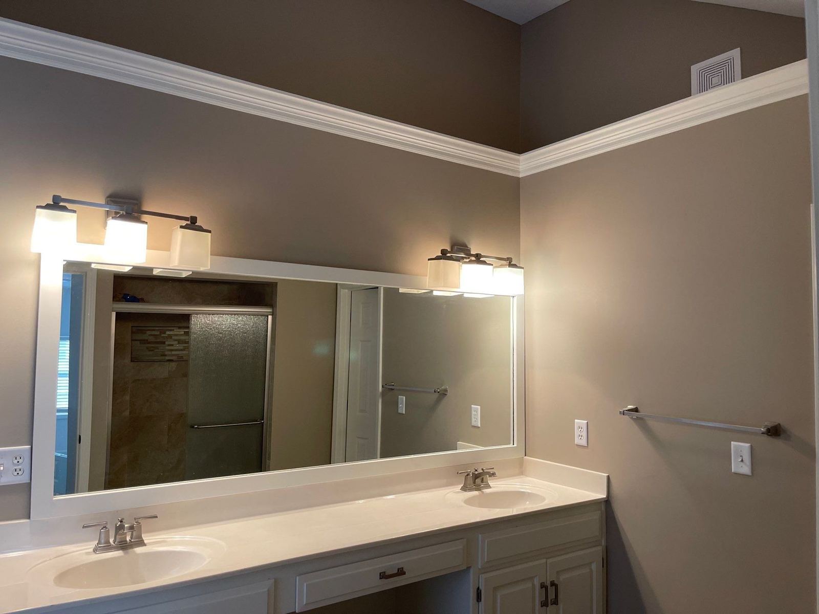 Bathroom remodel with double vanity by Uprise Remodeling