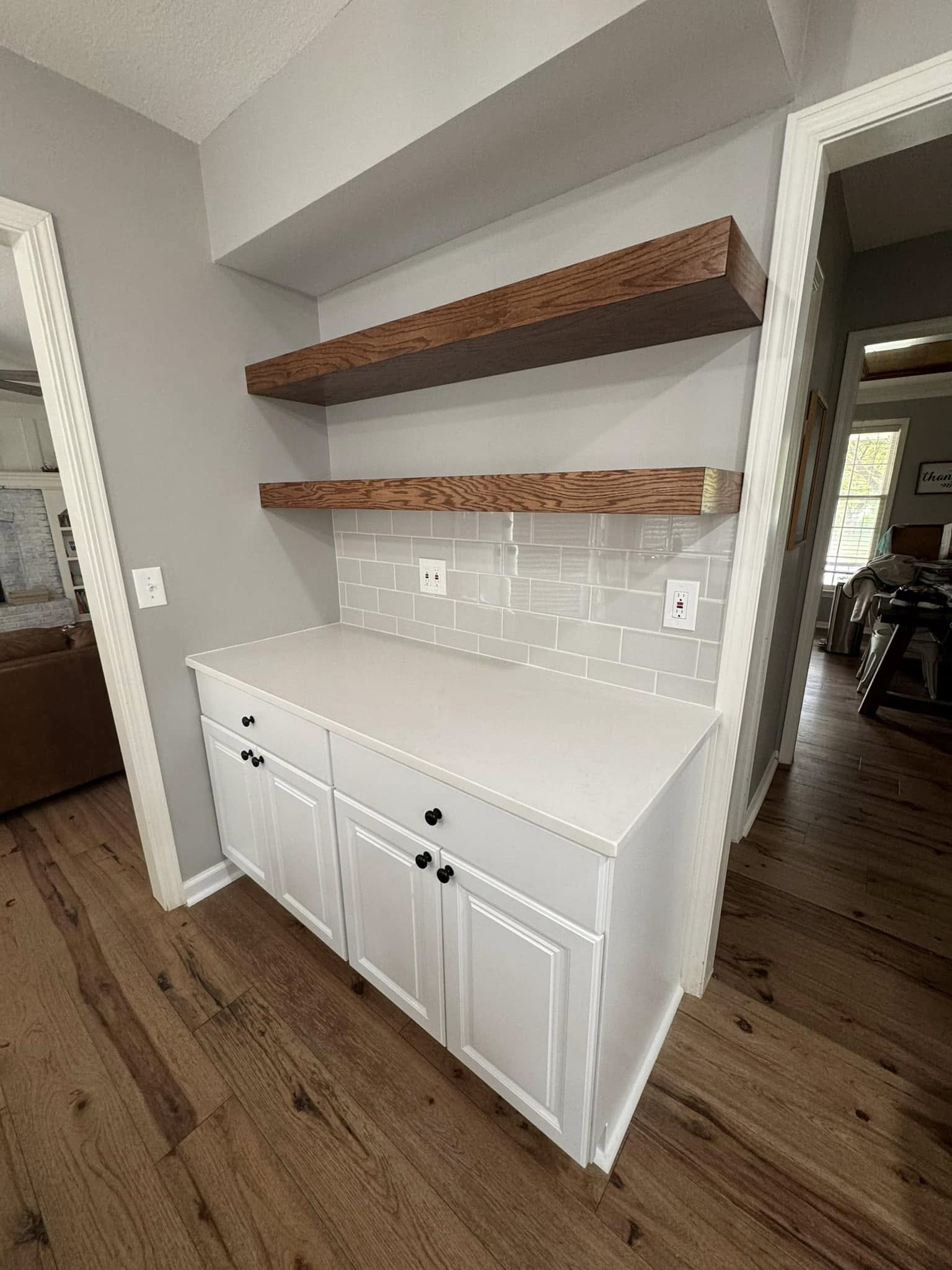 After: kitchen cabinet redesign with new cabinetry and floating shelves